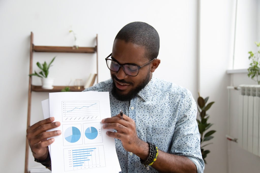 Smiling African American manager making data analytics presentation