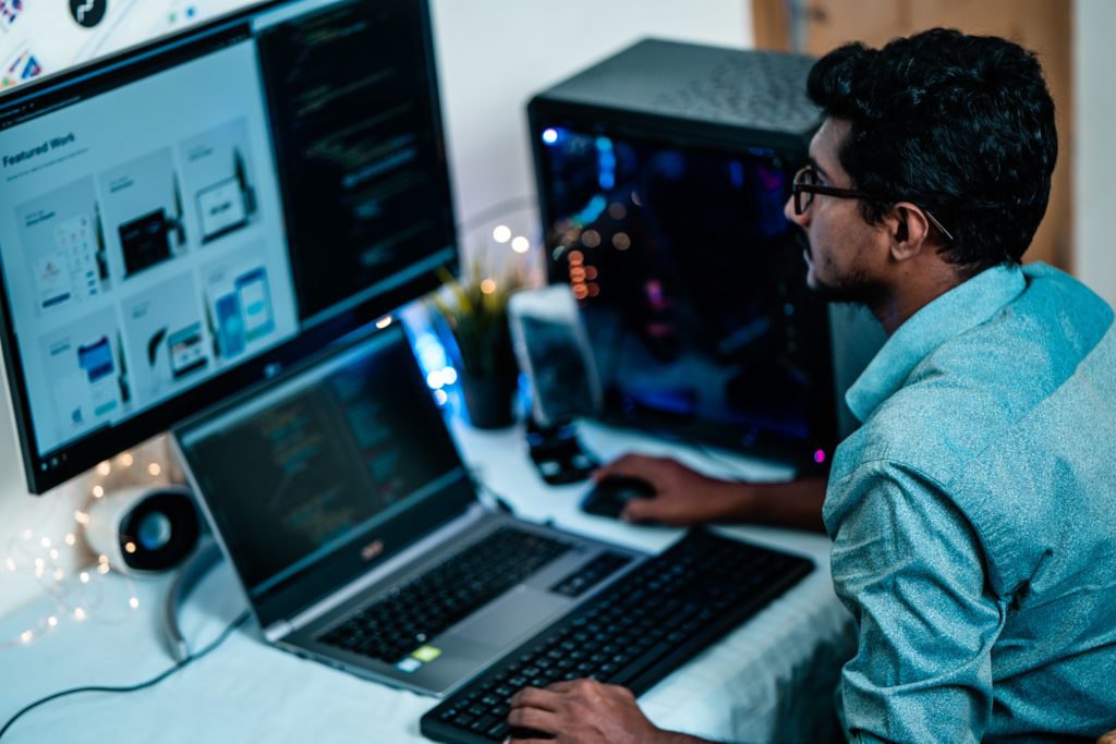 Male content marketer developing content on computer